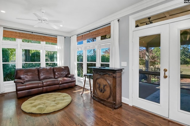 sunroom / solarium featuring french doors and ceiling fan