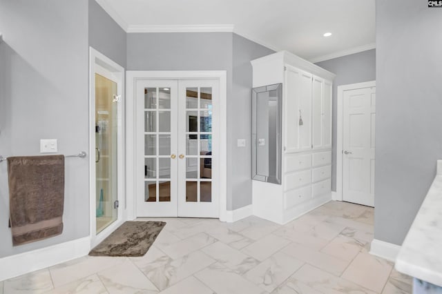 entryway featuring french doors and crown molding