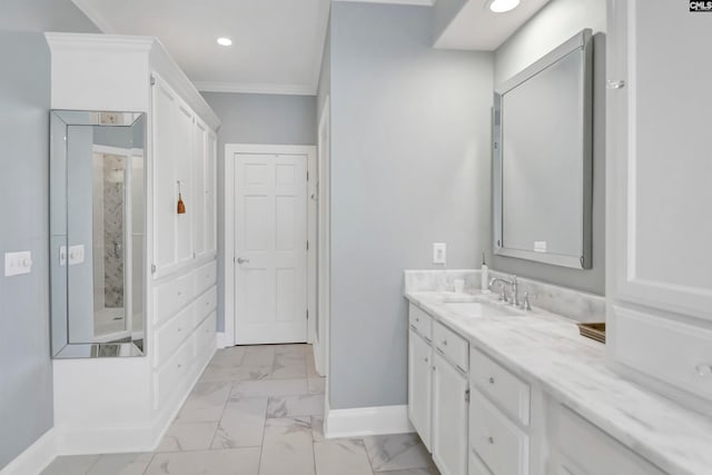 bathroom featuring ornamental molding and vanity