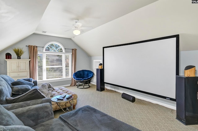 cinema room featuring ceiling fan, lofted ceiling, and carpet flooring