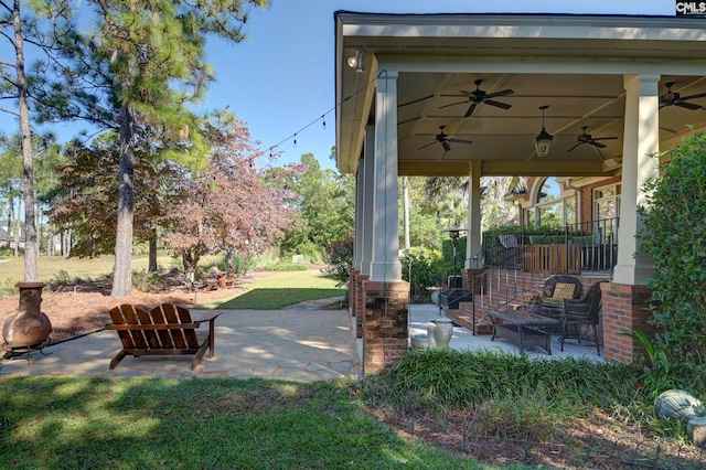 view of patio featuring ceiling fan