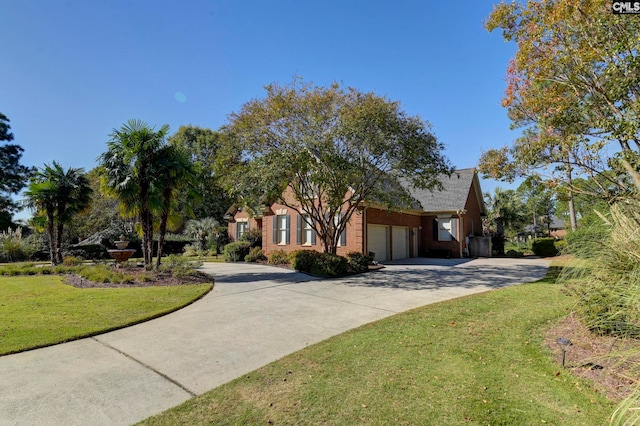 view of front of house featuring a garage and a front lawn