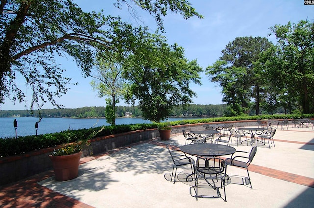 view of patio with a water view