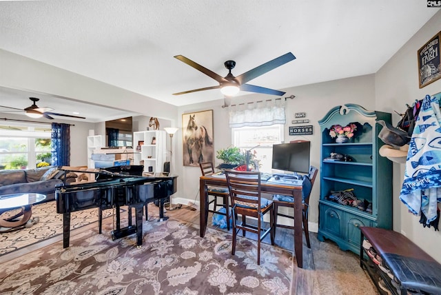 office featuring a textured ceiling, wood-type flooring, and ceiling fan