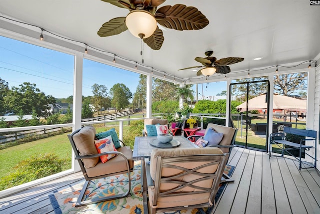 sunroom with ceiling fan