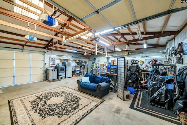 garage featuring a garage door opener and stainless steel fridge