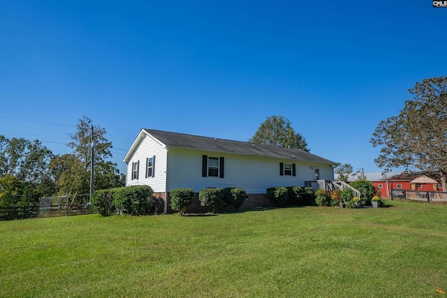 view of home's exterior with a yard