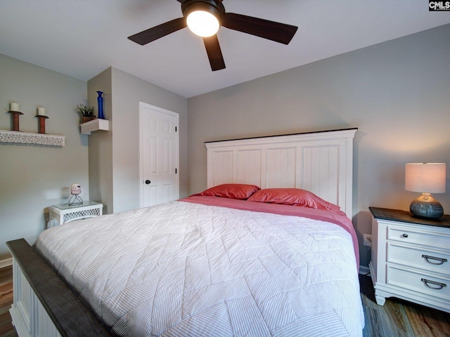 bedroom featuring ceiling fan and dark hardwood / wood-style flooring