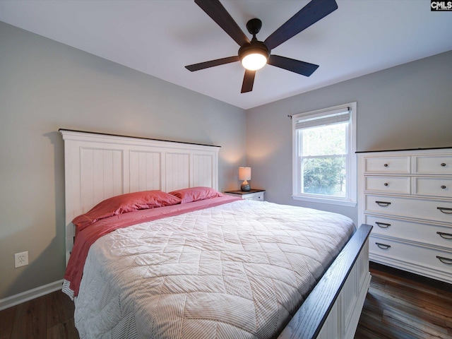 bedroom with dark hardwood / wood-style floors and ceiling fan