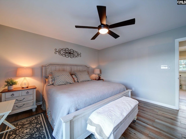 bedroom featuring connected bathroom, ceiling fan, and wood-type flooring