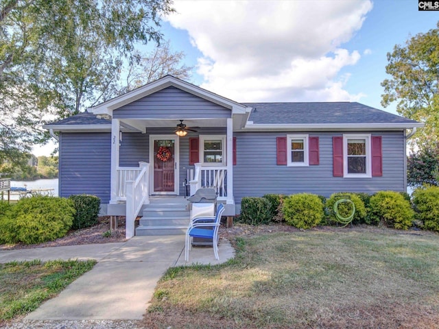 22 Garden Spot Rd, Camden, SC 29020 - view of front of property with covered porch, ceiling fan, a shingled roof, and a front lawn