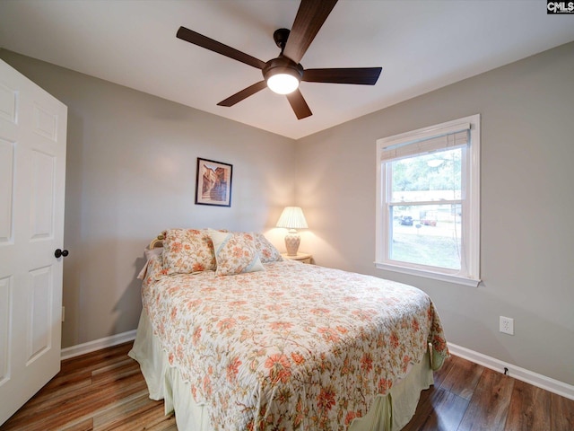 bedroom featuring hardwood / wood-style floors and ceiling fan