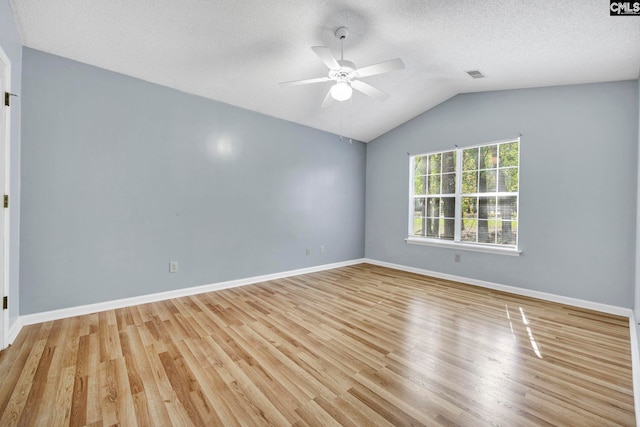 unfurnished room featuring lofted ceiling, light hardwood / wood-style flooring, and ceiling fan