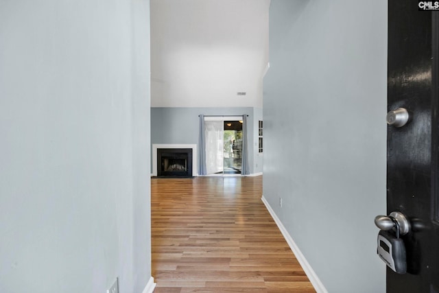 hall with light hardwood / wood-style floors