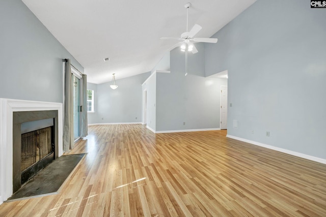 unfurnished living room with light hardwood / wood-style flooring, high vaulted ceiling, and ceiling fan