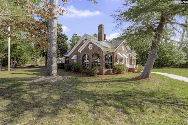 6560 Voorhees Rd, Denmark, SC 29042 - view of front of property with brick siding, a front lawn, and a chimney
