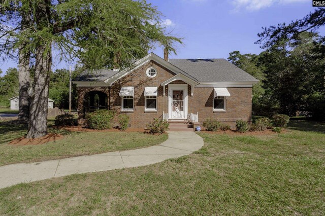 6560 Voorhees Rd, Denmark, SC 29042 - view of front of property featuring brick siding, a front yard, and a chimney
