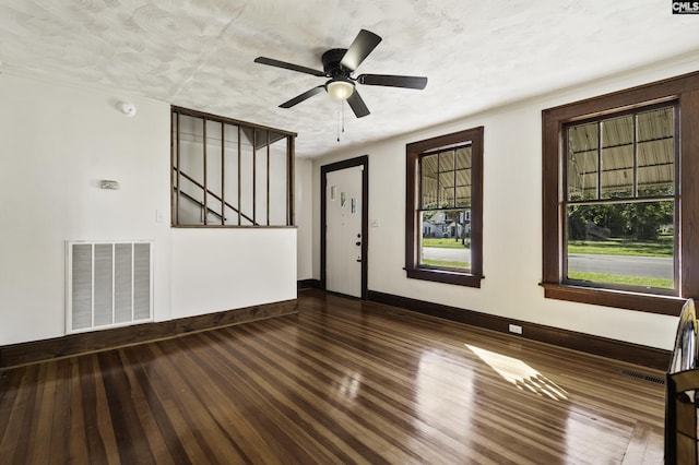 6560 Voorhees Rd, Denmark, SC 29042 - unfurnished room with wood finished floors, stairs, a ceiling fan, and a textured ceiling