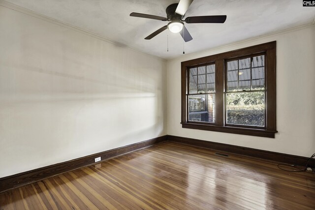 6560 Voorhees Rd, Denmark, SC 29042 - spare room featuring wood finished floors, ceiling fan, and ornamental molding