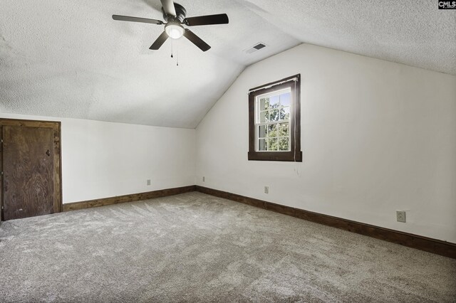 6560 Voorhees Rd, Denmark, SC 29042 - bonus room featuring a textured ceiling, carpet, a ceiling fan, and lofted ceiling