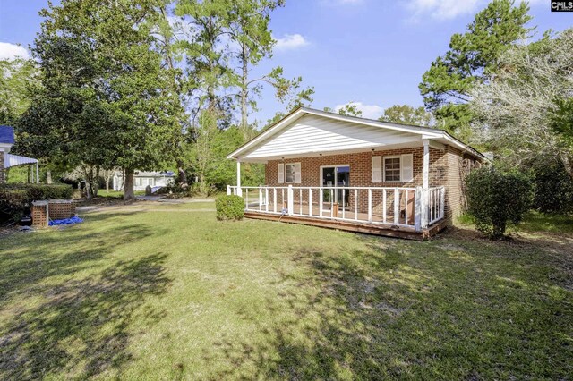 6560 Voorhees Rd, Denmark, SC 29042 - back of house with brick siding, a yard, and a deck