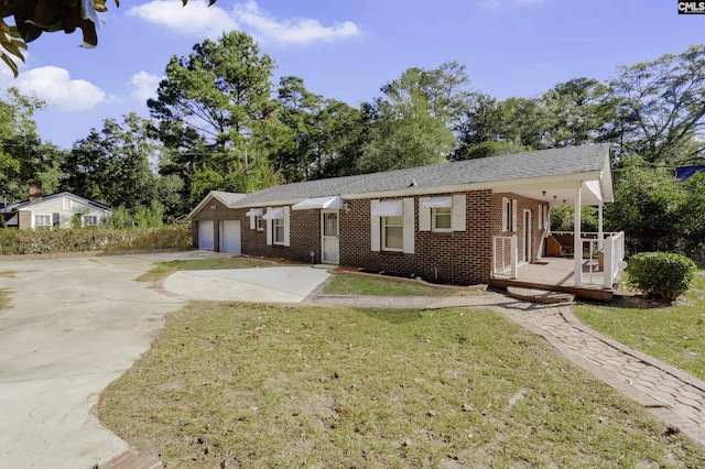 6560 Voorhees Rd, Denmark, SC 29042 - ranch-style home featuring brick siding, concrete driveway, and a front lawn