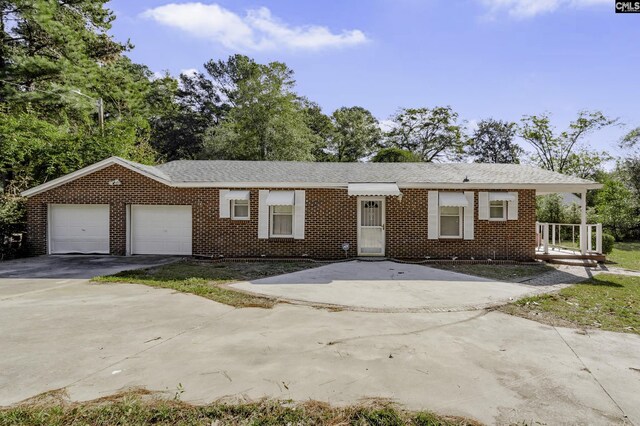 6560 Voorhees Rd, Denmark, SC 29042 - ranch-style house featuring brick siding, concrete driveway, and a garage