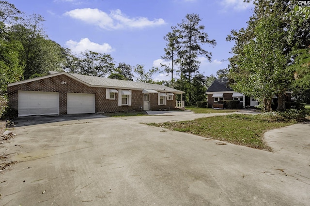 6560 Voorhees Rd, Denmark, SC 29042 - view of front of property featuring brick siding, concrete driveway, and an attached garage