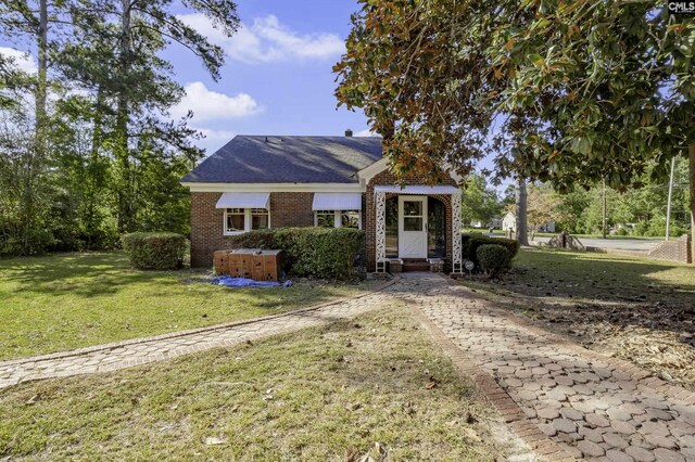6560 Voorhees Rd, Denmark, SC 29042 - view of front of property featuring brick siding and a front yard