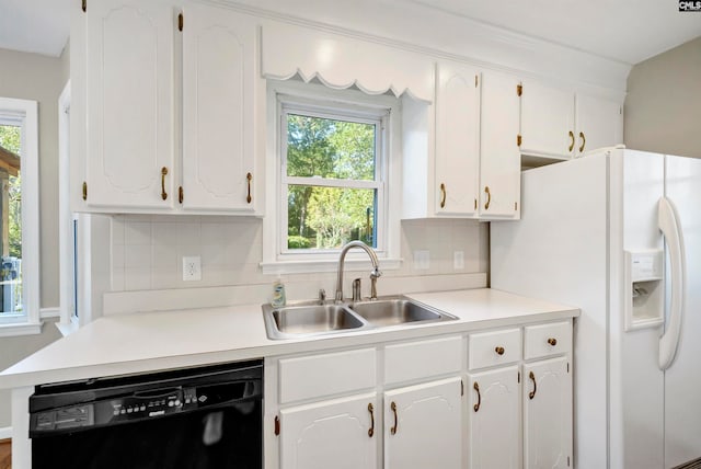 kitchen with dishwasher, sink, white refrigerator with ice dispenser, white cabinets, and tasteful backsplash