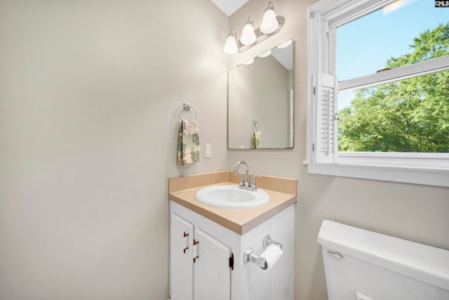 bathroom with vanity and toilet