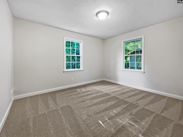 6731 Formosa Dr, Columbia, SC 29206 - unfurnished room featuring carpet, baseboards, and a textured ceiling