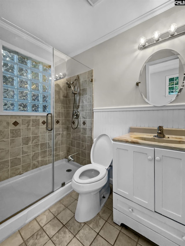6731 Formosa Dr, Columbia, SC 29206 - bathroom featuring a shower stall, vanity, toilet, ornamental molding, and tile patterned flooring