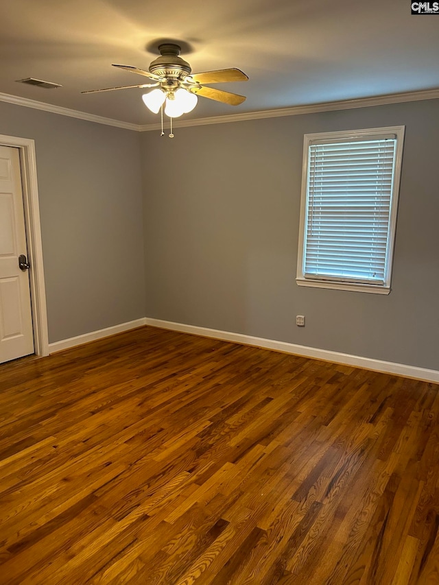 spare room featuring ornamental molding, wood-type flooring, and ceiling fan