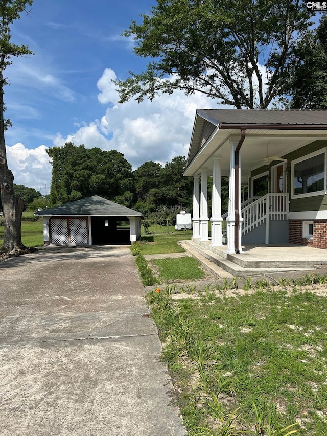 view of property exterior with a lawn and a porch