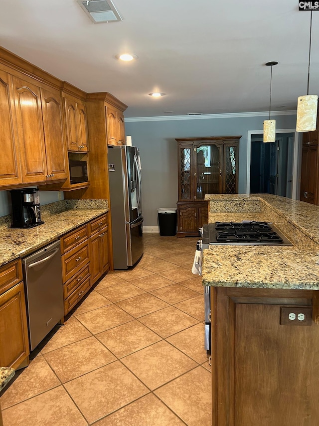 kitchen with ornamental molding, stainless steel appliances, hanging light fixtures, and light tile patterned floors