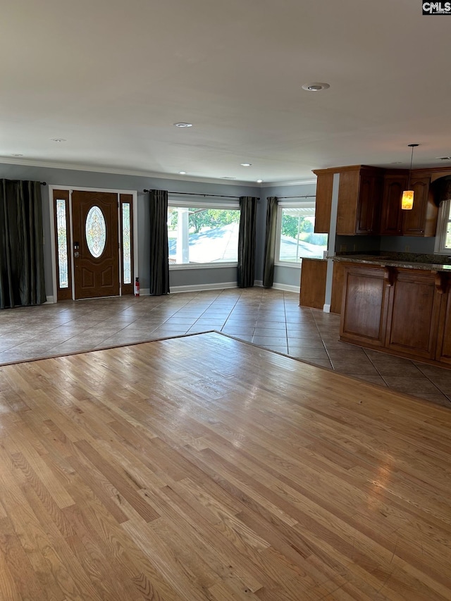 unfurnished living room featuring light hardwood / wood-style flooring