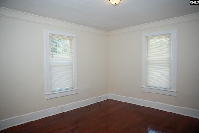 unfurnished room featuring ornamental molding and hardwood / wood-style floors