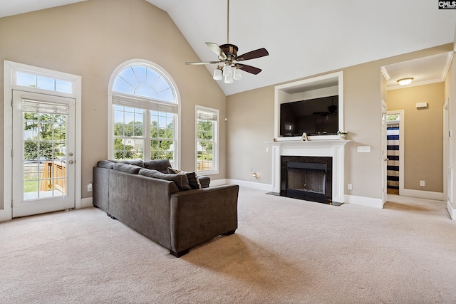 carpeted living room with high vaulted ceiling and ceiling fan