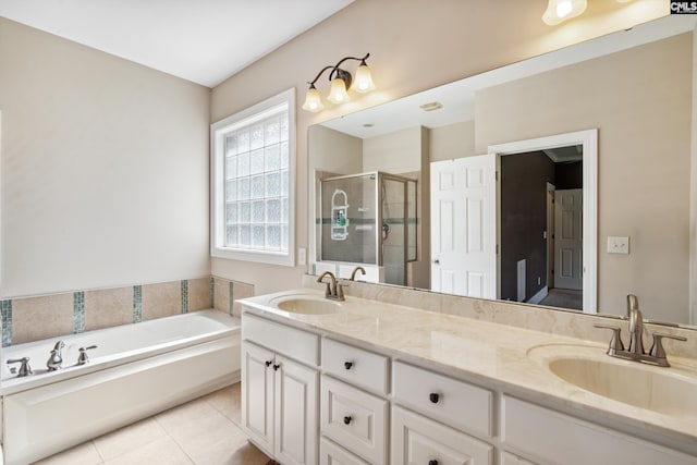 bathroom with vanity, independent shower and bath, and tile patterned floors