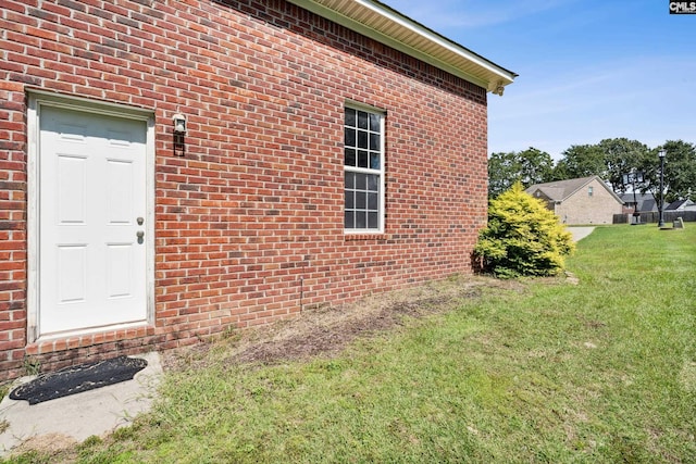 view of property exterior with a lawn