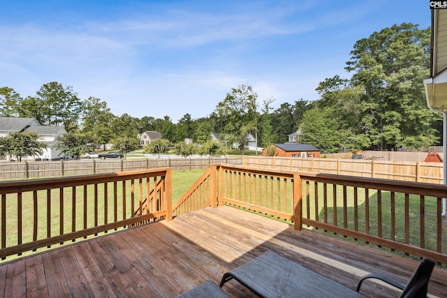 wooden deck with a lawn