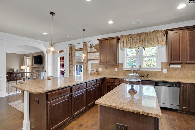 kitchen with kitchen peninsula, dark wood-type flooring, hanging light fixtures, stainless steel dishwasher, and a center island