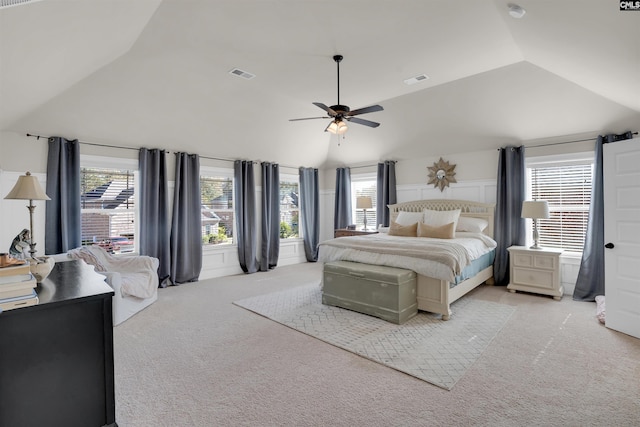 bedroom with vaulted ceiling, ceiling fan, and light colored carpet