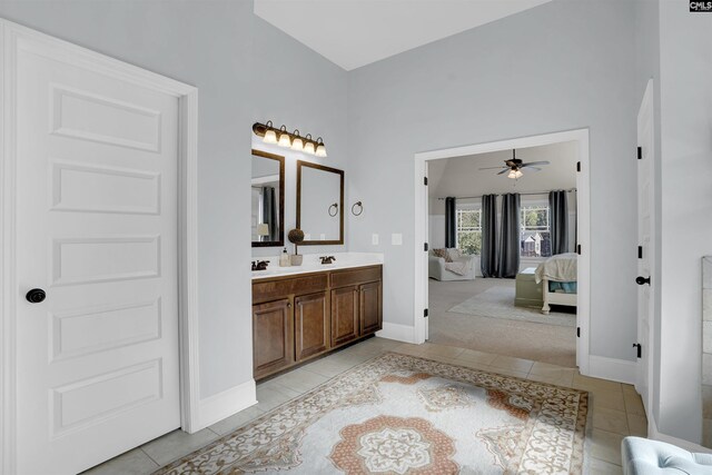 bathroom with ceiling fan, vanity, and tile patterned flooring