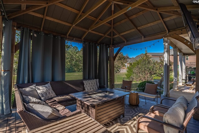 view of patio / terrace with an outdoor living space with a fire pit and a gazebo