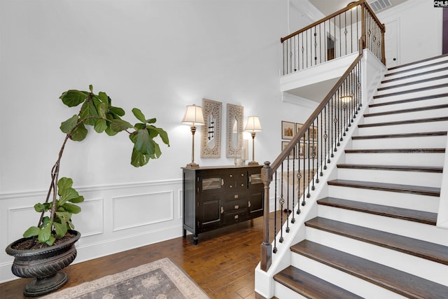 stairs featuring hardwood / wood-style floors