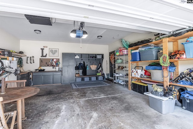 garage featuring a workshop area and a garage door opener