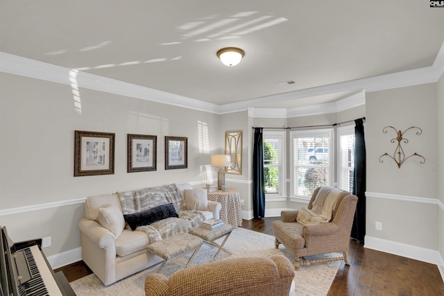 living room featuring dark wood-type flooring and crown molding