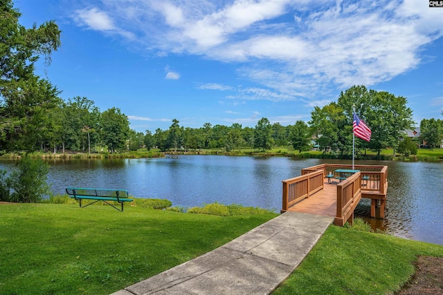 view of dock featuring a yard and a water view